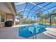 Relaxing pool and patio with covered lanai, grill, and ample space for entertaining at 2744 Mill Creek Rd, Port Charlotte, FL 33953