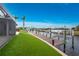 Private backyard dock with artificial turf and access to the waterway at 3015 Curry Ter, Port Charlotte, FL 33981