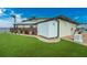 Generator and storage shed in a landscaped backyard at 3015 Curry Ter, Port Charlotte, FL 33981