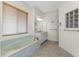 Spa-like bathroom featuring a large garden tub and updated vanity at 3015 Curry Ter, Port Charlotte, FL 33981