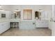 Spa-like bathroom with double sinks, a large soaking tub, and updated fixtures at 3015 Curry Ter, Port Charlotte, FL 33981