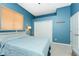 Blue walls and a comfy double bed in this bedroom at 3015 Curry Ter, Port Charlotte, FL 33981