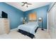 Bright bedroom with a double bed and light blue walls at 3015 Curry Ter, Port Charlotte, FL 33981