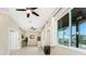 Bonus room with ceiling fan, tiled floor, and sliding glass doors at 3015 Curry Ter, Port Charlotte, FL 33981