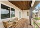 Deck with glass top table and wicker chairs, overlooking the neighborhood at 3015 Curry Ter, Port Charlotte, FL 33981