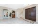 Grand entryway showcasing a staircase, tile flooring, and double doors at 3015 Curry Ter, Port Charlotte, FL 33981