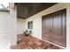 Inviting front porch with double doors and wood-like tile flooring at 3015 Curry Ter, Port Charlotte, FL 33981