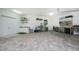 Garage with storage cabinets, sink, and workshop area at 3015 Curry Ter, Port Charlotte, FL 33981