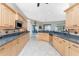 Spacious kitchen with granite countertops and stainless steel appliances at 3015 Curry Ter, Port Charlotte, FL 33981