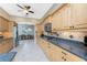 Spacious kitchen featuring granite countertops and stainless steel appliances at 3015 Curry Ter, Port Charlotte, FL 33981