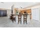 Kitchen with island seating and view of the entryway at 3015 Curry Ter, Port Charlotte, FL 33981