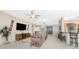Open living room with high ceilings and a view of the kitchen at 3015 Curry Ter, Port Charlotte, FL 33981