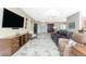 Spacious living room featuring a large TV and comfortable seating at 3015 Curry Ter, Port Charlotte, FL 33981