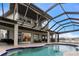 Luxury pool and patio with covered lanai and stunning water views at 3015 Curry Ter, Port Charlotte, FL 33981