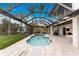 Spacious pool and patio area with covered lanai and water view at 3015 Curry Ter, Port Charlotte, FL 33981
