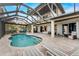 Resort-style pool and patio with covered lanai, offering scenic views at 3015 Curry Ter, Port Charlotte, FL 33981