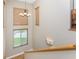 View from the top of the stairs, showing a spacious landing with natural light at 3015 Curry Ter, Port Charlotte, FL 33981