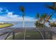 Stunning water view from a covered deck with tropical landscaping at 3015 Curry Ter, Port Charlotte, FL 33981
