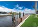 Wooden dock extending over calm water; perfect for enjoying water activities at 3015 Curry Ter, Port Charlotte, FL 33981