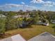 Aerial shot of a home near the canal with a shed, pool, and lush greenery at 3568 Middletown St, Port Charlotte, FL 33952