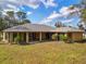 Expansive backyard with a covered lanai providing ample space for outdoor entertaining and relaxation at 3568 Middletown St, Port Charlotte, FL 33952