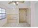 Bathroom featuring a tub, shower, and a large window for great natural lighting at 3568 Middletown St, Port Charlotte, FL 33952