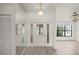 Bright foyer featuring gray floors, a closet, and a light fixture that is centrally located at 3568 Middletown St, Port Charlotte, FL 33952