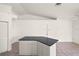 Spacious room featuring a granite kitchen island that provides ample counter and cabinet space at 3568 Middletown St, Port Charlotte, FL 33952