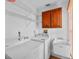 Functional laundry room equipped with a washer, dryer, sink, and cabinet for optimal convenience at 3568 Middletown St, Port Charlotte, FL 33952