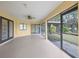 A comfortable enclosed patio with screened windows and access doors, perfect for entertaining guests at 3568 Middletown St, Port Charlotte, FL 33952