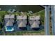 Aerial view of three waterfront homes sharing a common pool at 365 Englewood Isles Pkwy # 3, Englewood, FL 34223