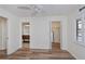 Bedroom with wood-like floors, and access to bathroom and closet at 365 Englewood Isles Pkwy # 3, Englewood, FL 34223