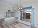Dining area with water views and stylish light fixture at 365 Englewood Isles Pkwy # 3, Englewood, FL 34223