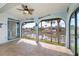 Enclosed Florida room with stunning water views and ceiling fan at 365 Englewood Isles Pkwy # 3, Englewood, FL 34223
