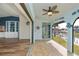 Bright Florida room with water views and wood-look floors at 365 Englewood Isles Pkwy # 3, Englewood, FL 34223