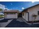 Attached garage with a spacious driveway and neatly landscaped yard at 365 Englewood Isles Pkwy # 3, Englewood, FL 34223