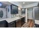 Modern kitchen with stainless steel appliances and blue cabinets at 365 Englewood Isles Pkwy # 3, Englewood, FL 34223