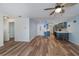 Open living room with light flooring and access to the kitchen at 365 Englewood Isles Pkwy # 3, Englewood, FL 34223