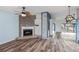 Spacious living room with fireplace and access to patio at 365 Englewood Isles Pkwy # 3, Englewood, FL 34223