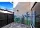 Charming patio with painted mural and gate at 365 Englewood Isles Pkwy # 3, Englewood, FL 34223