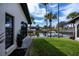 Landscaped side yard with canal and boat views at 365 Englewood Isles Pkwy # 3, Englewood, FL 34223