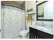 Well-lit bathroom with a shower/tub, granite countertop, and decorative shelves at 4 White Marsh Ln, Rotonda West, FL 33947