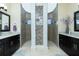 Spa-like bathroom with dual vanities, granite countertops, and a large walk-in shower at 4 White Marsh Ln, Rotonda West, FL 33947