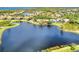 Aerial view showing home's location on a lake within a community at 4233 Grosse Pointe Dr, Port Charlotte, FL 33953