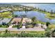 Waterfront property with two houses and a shared circular drive at 4233 Grosse Pointe Dr, Port Charlotte, FL 33953