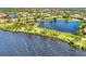Aerial view showing home's location on lake in community at 4233 Grosse Pointe Dr, Port Charlotte, FL 33953