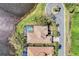 Bird's eye view of home and circular driveway near lake at 4233 Grosse Pointe Dr, Port Charlotte, FL 33953