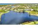 Aerial view highlighting home's location on lake in community at 4233 Grosse Pointe Dr, Port Charlotte, FL 33953