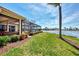 Landscaped backyard with pool and lake view at 4233 Grosse Pointe Dr, Port Charlotte, FL 33953