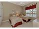 Cozy bedroom with two twin beds and water views at 4233 Grosse Pointe Dr, Port Charlotte, FL 33953